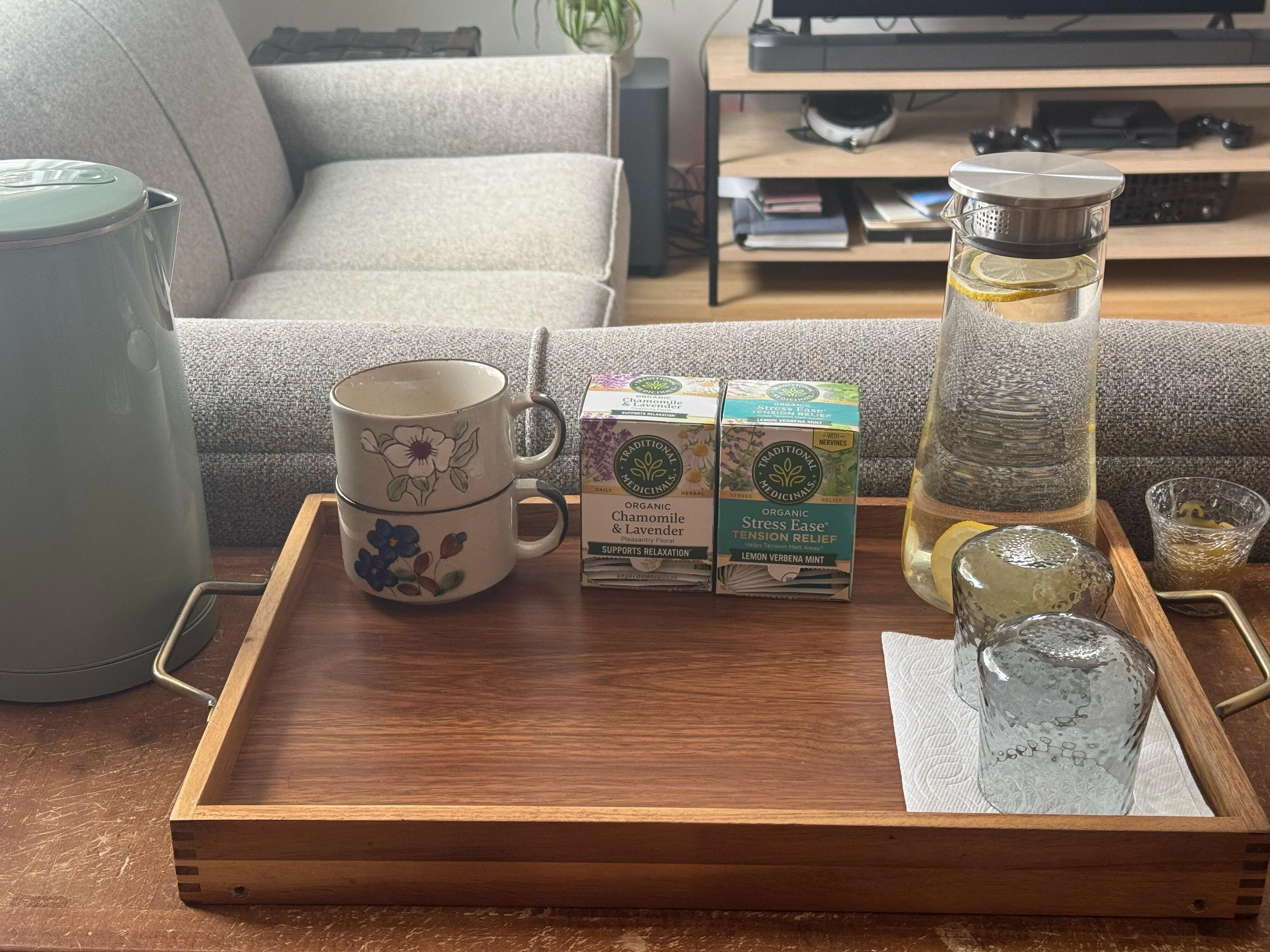 A tray of herbal tea and lemon water in the waiting area